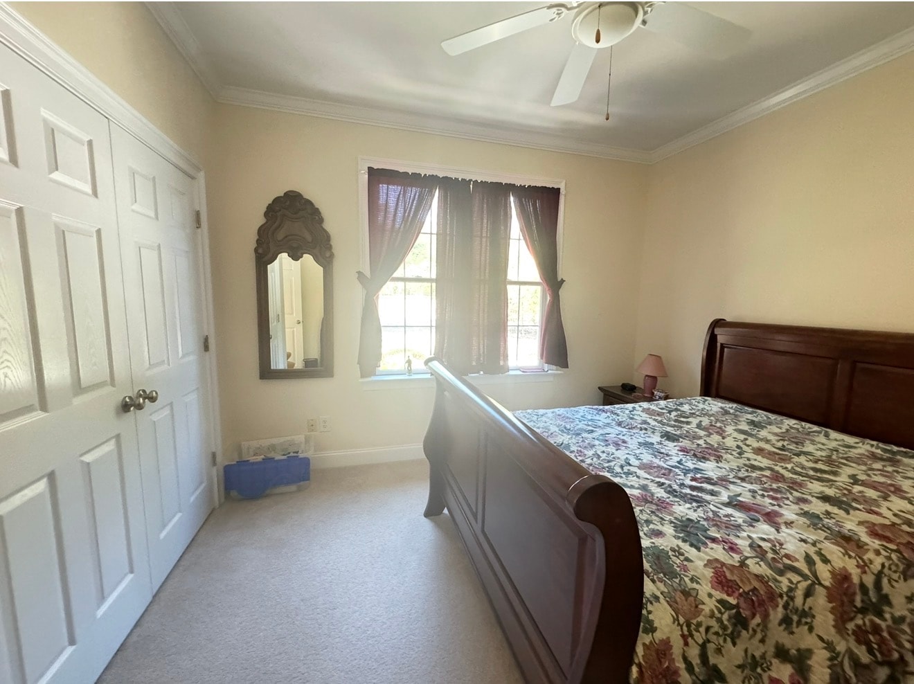 Bedroom before listing-ready refresh — sleigh bed, floral bedding